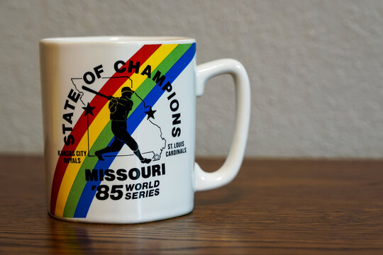 Vintage coffee mug commemorating the 1985 World Series featuring the Kansas City Royals and St. Louis Cardinals on a desk, Sedalia, Missouri, June 2026