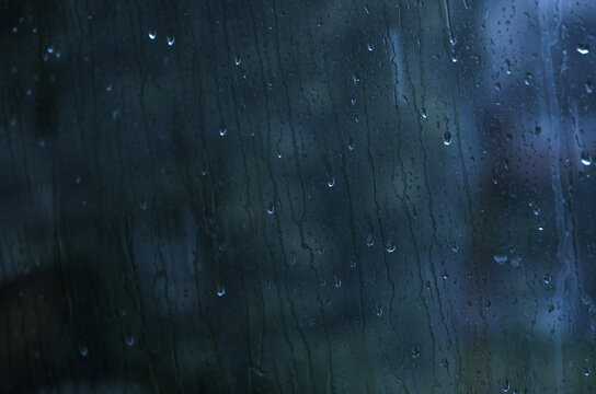 Rain drops on window glasses surface.