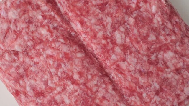 Raw ground pork meat texture top view rotating