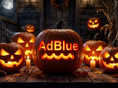 Glowing Halloween Pumpkin Beside AdBlue Dashboard Warning