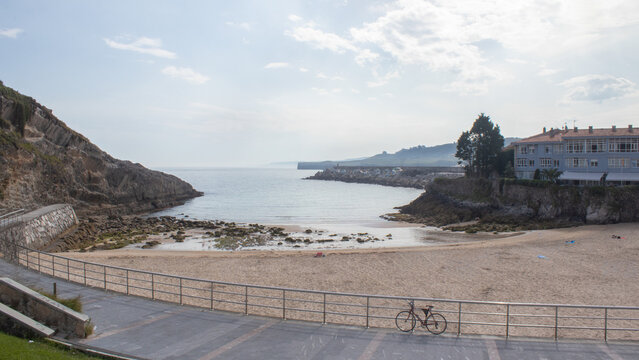 Llanes bay with beach and bicycle in Asturias