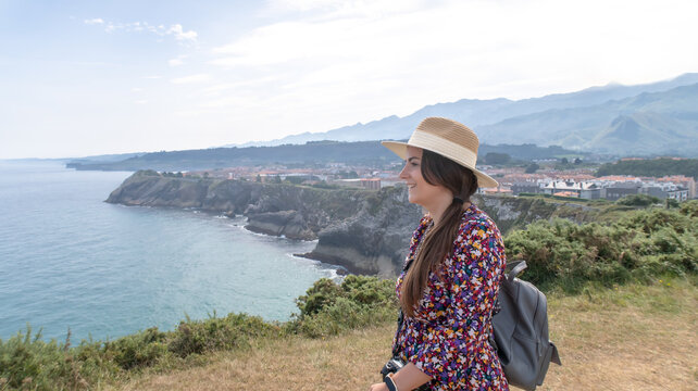 Woman enjoying coastal view in Llanes Asturias Spain