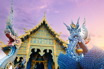 Fototapeta premium Wat Rong Suea Ten, Blue temple complex at sunset glow Chiang Rai, Thailand