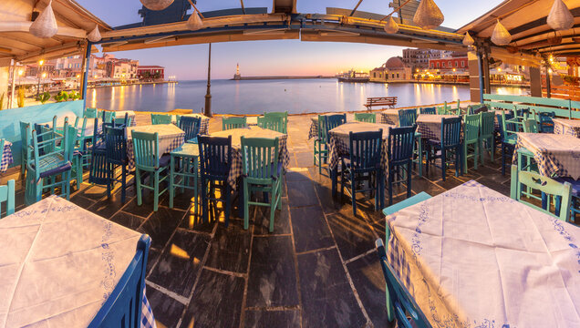 Panoramic View of Chania Harbor from Traditional Taverna at Sunrise, Crete, Greece
