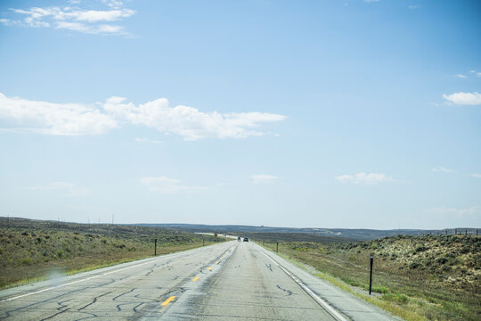 Long Straight Road Stretching into the Distance Across Rural Midwestern USA