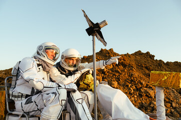 Exploration team on Mars preparing for scientific work and observations during sunset © Kokhan O
