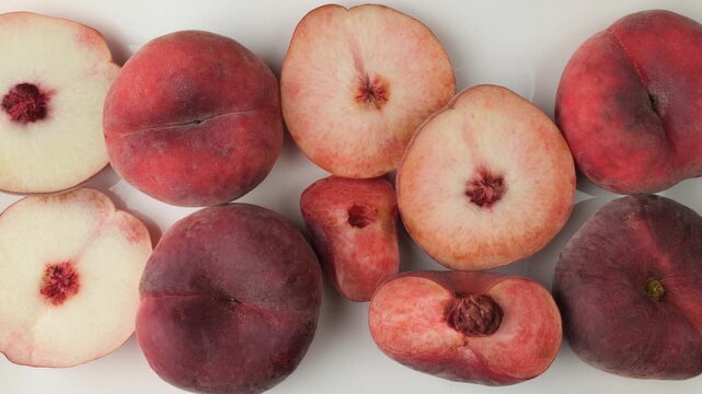 Ripe Saturn peaches isolated on a white background