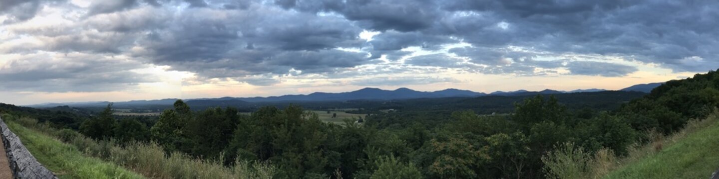 Dramatic evening sky over rolling mountains