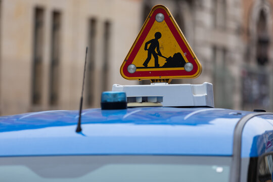 Illuminated Roadworks Warning Sign on a Maintenance Vehicle