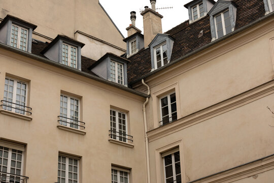 Traditional Parisian Buildings and Street Lamps on a Quiet Historic Street
