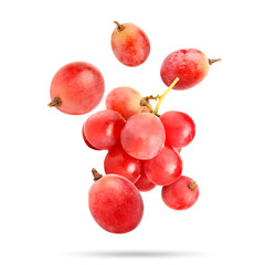 Obraz premium Fresh pink grapes falling against white background