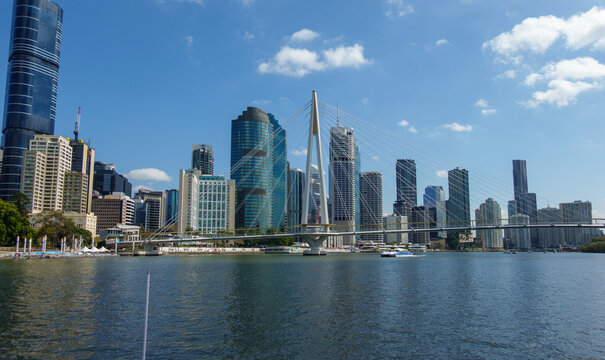 Support and stays of pedestrian and cycling Kangaroo Point Bridge spanning the Brisbane River in front of the Brisbane skyline in Queensland, Australia.