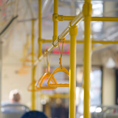 Close-up of interior handrails in a city tram or bus with shallow depth of field, suitable for transit, mobility, passenger safety and travel themes Photo © slexp880