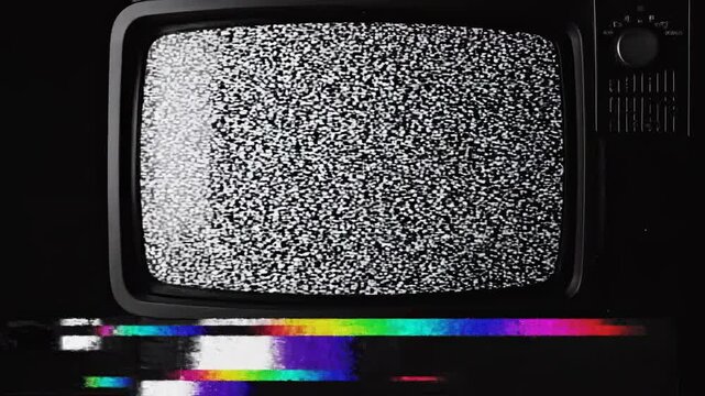 Vintage television static dissolving into vibrant color bars during a digital glitch effect with cinematic motion