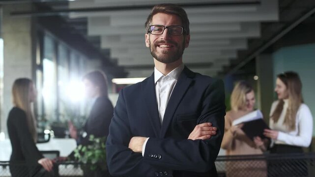 Successful business man standing with his staff	