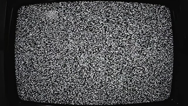 Vintage television static transitioning from blank screen to full snow with cinematic lighting