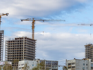 Tower crane at a construction site against the sky © Dmitrii Potashkin