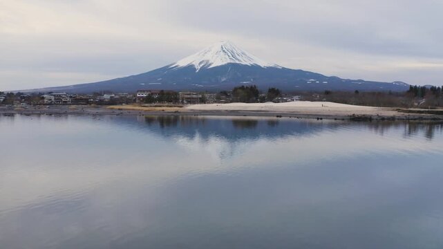 Telephoto View of Mount Fuji Across Lake Kawaguchiko Shoreline and Calm Water