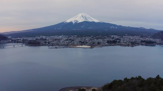 Telephoto Aerial View of Mount Fuji Above Forest and Fujikawaguchiko Town