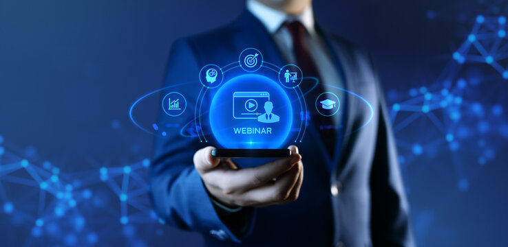 Businessman Holding Smartphone with Webinar Icons on Screen. E-learning and Education Concept