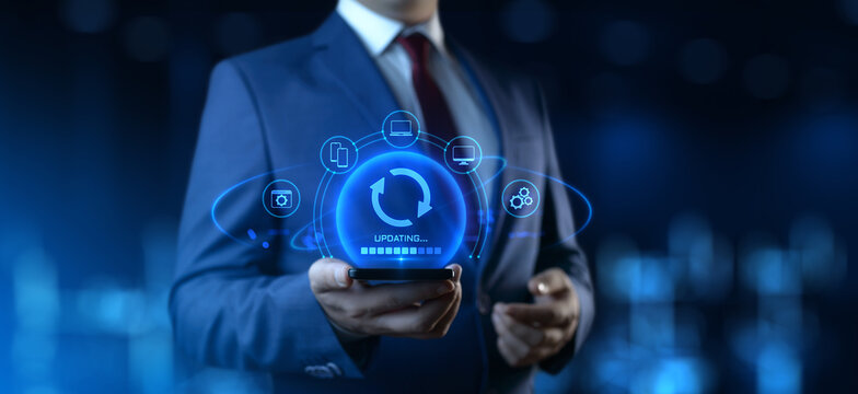 Businessman Holding Device with Update Icons on Screen. Software Updating or Upgrade Concept