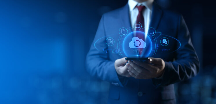 Businessman Holding smartphone with Cloud Computing Icons on Screen. Data transfer and Cloud Backup technology