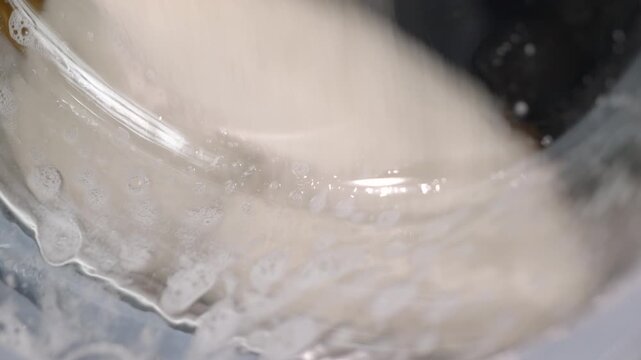 Washing toys in a washing machine. Close-up of soft toys in soapy water in a washing machine