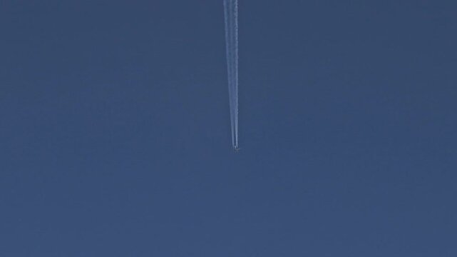 Aircraft straight trail smoke with focusing effect at beginning video 4K