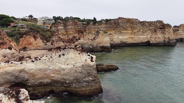 Dramatic rocky coastline at three brothers beach in portugal