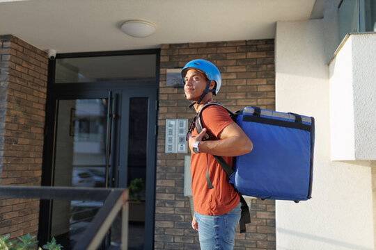 Food delivery service courier reaching delivery destination