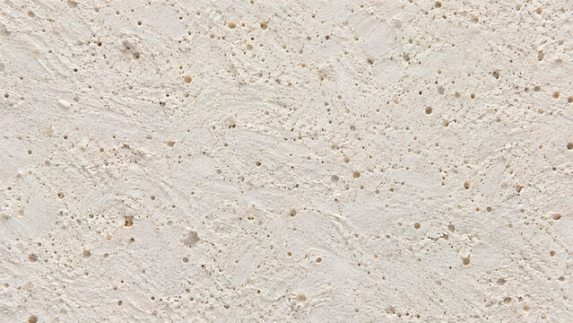 Textured beige plaster wall surface, rough stucco cement background, organic stone grain material for architectural design and interior rendering