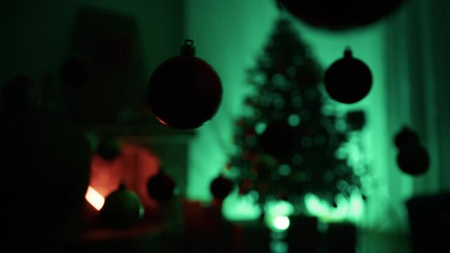 Silhouette of Christmas balls swinging on a green background
