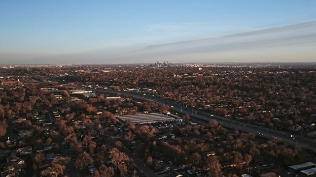 Wide aerial cityscape of denver, colorado, withsuburban highway traffic 4K 