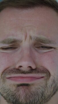 Close-up of disappointed man shaking his head in disapproval, showing doubt, disagreement and a negative reaction.