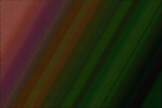 Glowing LED dots on black background green digital light pattern with blue and orange bokeh vibrant abstract design 