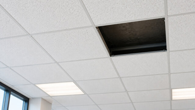Suspended Office Ceiling with One Missing Acoustic Tile