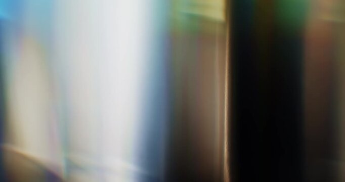 Colorful light refraction of smooth reflective glass prism with lens chromatic aberration and optical distortion effects in a rainbow of colors. Shining lights reflect highlights on angled glass Loop