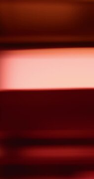 Soft lights illuminate the brilliance of reflective glass creating a moving gradient of smooth amber colors. Swirl of dreamy lighting creating a warm aura for an abstract background or wallpaper Loop