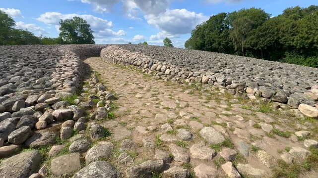 Entrance to King's grave, a 75-meter-diameter Bronze Age cairn containing a coffin with ten stone slabs with carved figures, in Kivik, Simrishamn Municipality, Sk&aring;ne County, Sweden, Scandinavia