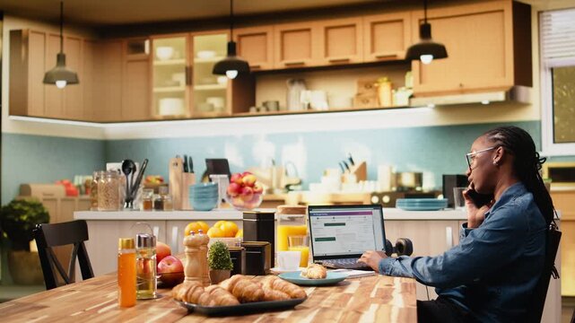 Black woman calls customer service for package tracking verification, solving transport issue with real-time shipment updates while checking delivery delay, tracking number details online.