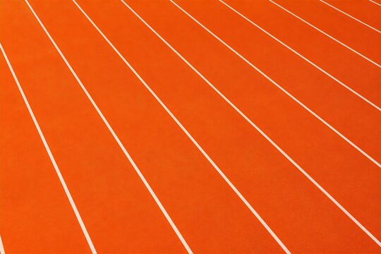 Athletic track lanes stretching across sports surface