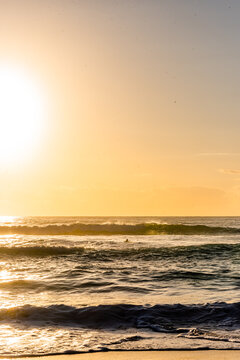 Intense Sun Glare and Reflections on Breaking Waves at Beach