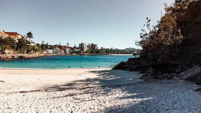 Lower Aerial View of Serene Beach and Clear Blue Water