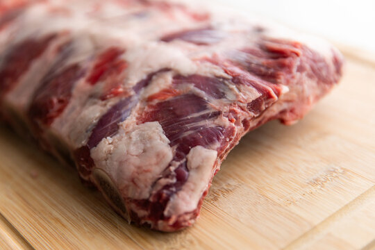close up of beef ribs on a chopping board