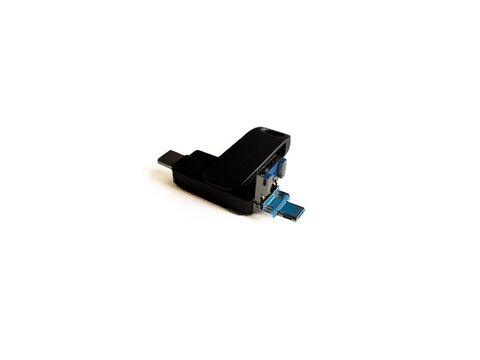 Black multi-connector USB flash drive with Lightning and Type-C adapters isolated on white background, portable data storage device.
