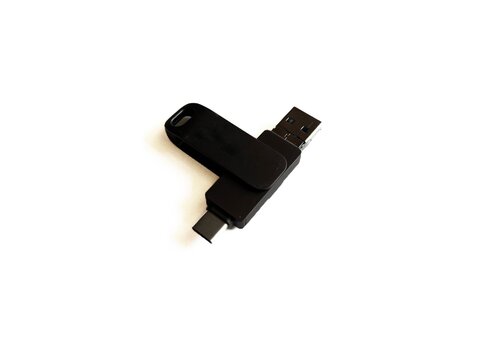 Black multi-connector USB flash drive with Lightning and Type-C adapters isolated on white background, portable data storage device.
