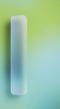 Abstract vertical rounded oblong glass pillar featuring a smooth gradient of green and blue tones with soft frosted transparency against a matching blurred background for modern digital design