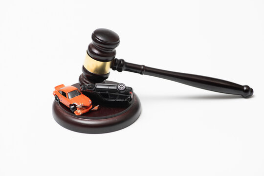 Gavel in traffic court for confiscation and repossession. Car in traffic court for foreclosure bankruptcy and purchase. Gavel for fine and penalty in traffic court. Car for claim insurance.