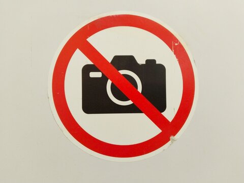 No Photography Sign on White Background