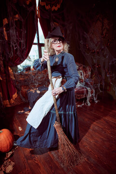 Witch Holding Broom